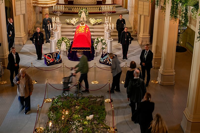 People walk past the coffin of late Norway's King Harald in Oslo, 1 September, 2026