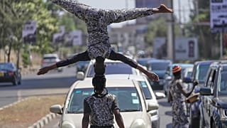 Nairobi's street acrobats make a living by performing for motorists