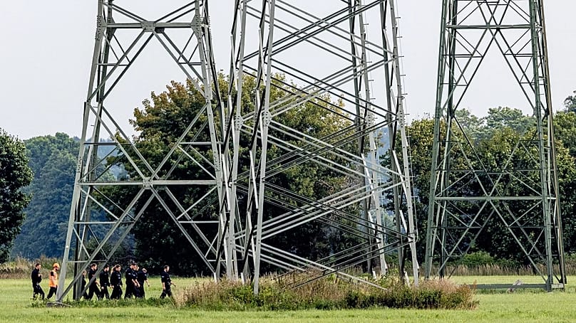 Police search the area around the extra-high-voltage power lines near the Turnow-Preilack substation and the Jänschwalde power plant in Preilack, 3 September, 2026