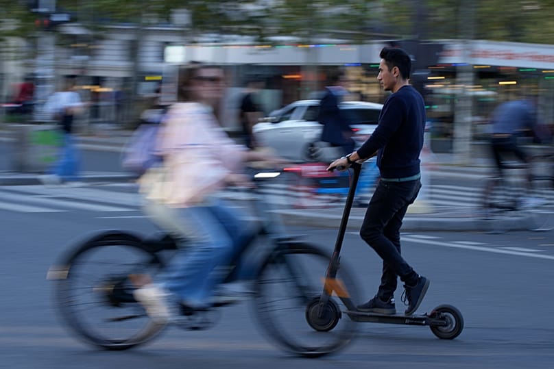 A man riding an electric scooter in Paris, 10 October, 2023