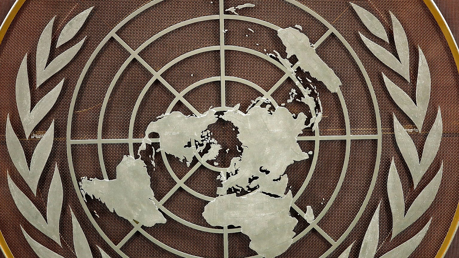 FILE: The United Nations logo is seen at the General Assembly hall at UN headquarters, 21 September 2021