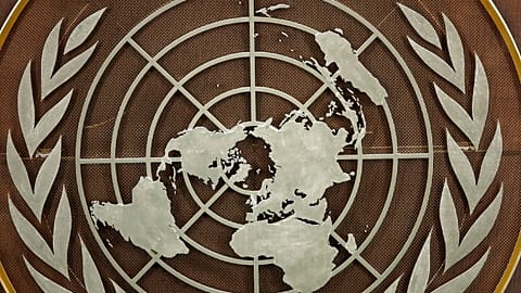 FILE: The United Nations logo is seen at the General Assembly hall at UN headquarters, 21 September 2021