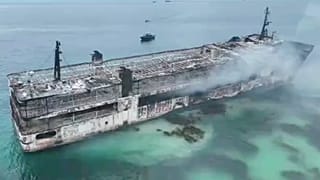 This image taken from video provided by the Philippine Coast Guard, shows smoldering remains of ferry that caught fire off wester Philippines on 10 September 2026.