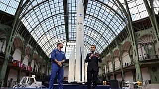 FILE:French President Emmanuel Macron and French European Space Agency astronaut Thomas Pesquet during the International Space Summit at the Grand Palais, Paris, 10 September.