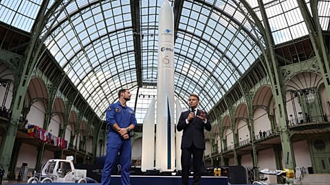 FILE:French President Emmanuel Macron and French European Space Agency astronaut Thomas Pesquet during the International Space Summit at the Grand Palais, Paris, 10 September.