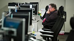 FILE. A person works on a computer at the Department of Homeland Security's National Cybersecurity and Communications Integration Center in Arlington, Virginia, Aug. 2018