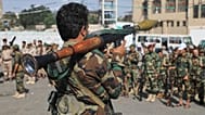 A Houthi fighter carries a rocket-propelled grenade launcher as they march during a mobilisation campaign in Sana'a, 10 September 2026