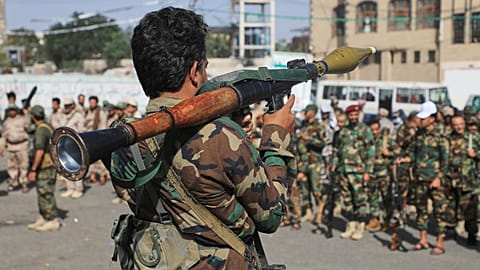 A Houthi fighter carries a rocket-propelled grenade launcher as they march during a mobilisation campaign in Sana'a, 10 September 2026