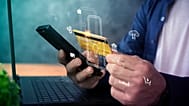 A man using his phone to pay