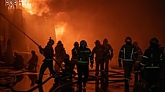 In this photo provided by the Ukrainian Emergency Service, firefighters put out a fire following a Russian drone attack in Kyiv, Dnipropetrovsk region, Ukraine, Sept. 11, 2026