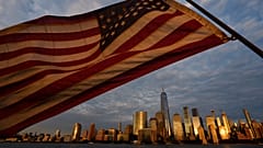 An American flag flies, with the lower Manhattan skyline in background, Wednesday, Sept. 9, 2026, in Jersey City, NJ.