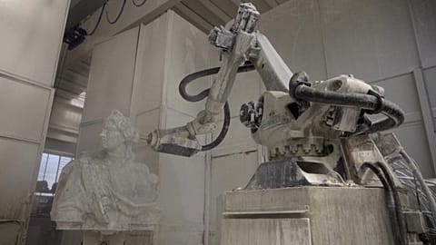A robotic arm carving a marble sculpture at the Carrara marble quarries in the Apuan Alps.