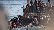 Migrants try to cross from Morocco into the Spanish enclave of Ceuta, July 30, 2026