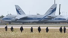 Police officers at Leipzig Airport search for a drone that may be connected to a suspected attack, August 2026.