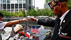 People join hands in prayer for Father Mychal Judge during a ceremony marking the 25th anniversary of the 9/11 attacks in New York City on 11 September 2026.