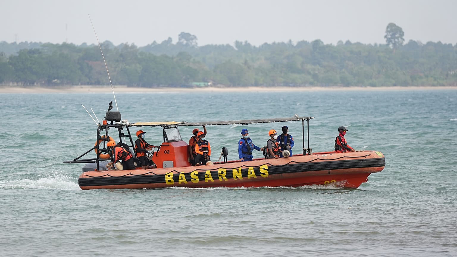 Rescuers ride on a rubber boat during the search for the journalists who went missing while covering the eruption of Mount Anak Krakatau, in Pandeglang, Indonesia.