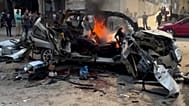 Горящий автомобиль после израильского авиаудара