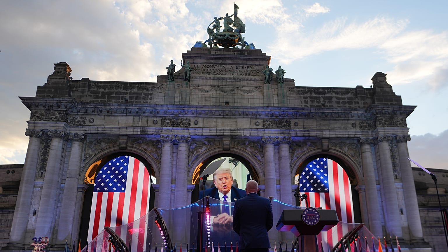 U.S. Ambassador to Belgium Bill White, center, listens to a pre-recorded address by U.S. President Donald Trump during the America 250 event in Brussels, Sunday, June 28, 2026