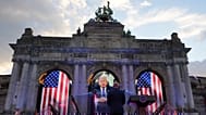 U.S. Ambassador to Belgium Bill White, center, listens to a pre-recorded address by U.S. President Donald Trump during the America 250 event in Brussels, Sunday, June 28, 2026