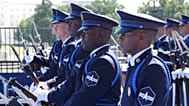 Members of U.S. Space Force perform on the track before the IndyCar Freedom 250 Grand Prix auto race in Washington, Sunday, Aug. 23, 2026.
