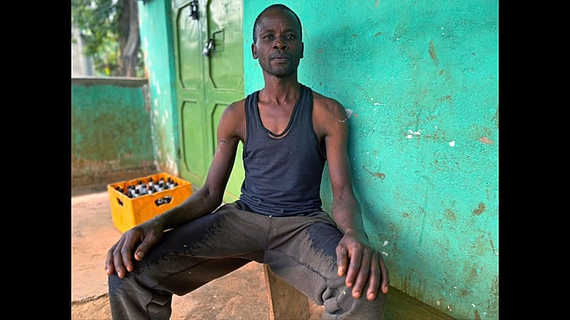 In this photo taken with a smartphone, David Nabutsilili, a rainmaker, poses for a photo in Namisindwa, Uganda, Tuesday, Sept. 3, 2026. 