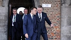 Slovakia's Prime Minister Robert Fico, right, and French President Emmanuel Macron during the EU summit at Alden Biesen Castle in Bilzen-Hoeselt, Belgium, Feb. 12, 2026