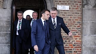 Slovakia's Prime Minister Robert Fico, right, and French President Emmanuel Macron during the EU summit at Alden Biesen Castle in Bilzen-Hoeselt, Belgium, Feb. 12, 2026