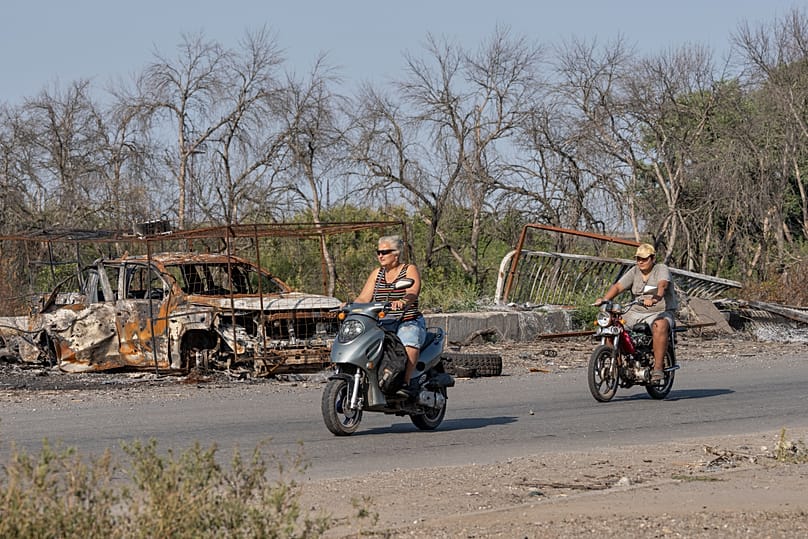 Local residents ride the bikes in the frontline town of Druzhkivka, Donetsk region, Ukraine, Sept. 12, 2026,.