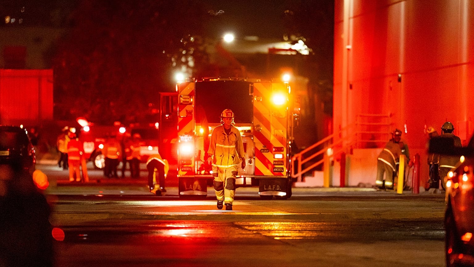 First responders work the scene after a helicopter crashed near a bus crash in Chatsworth, a neighborhood in Los Angeles, Tuesday, Sept. 15, 2026. (AP Photo/Ethan Swope)