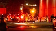 First responders work the scene after a helicopter crashed near a bus crash in Chatsworth, a neighborhood in Los Angeles, Tuesday, Sept. 15, 2026. (AP Photo/Ethan Swope)