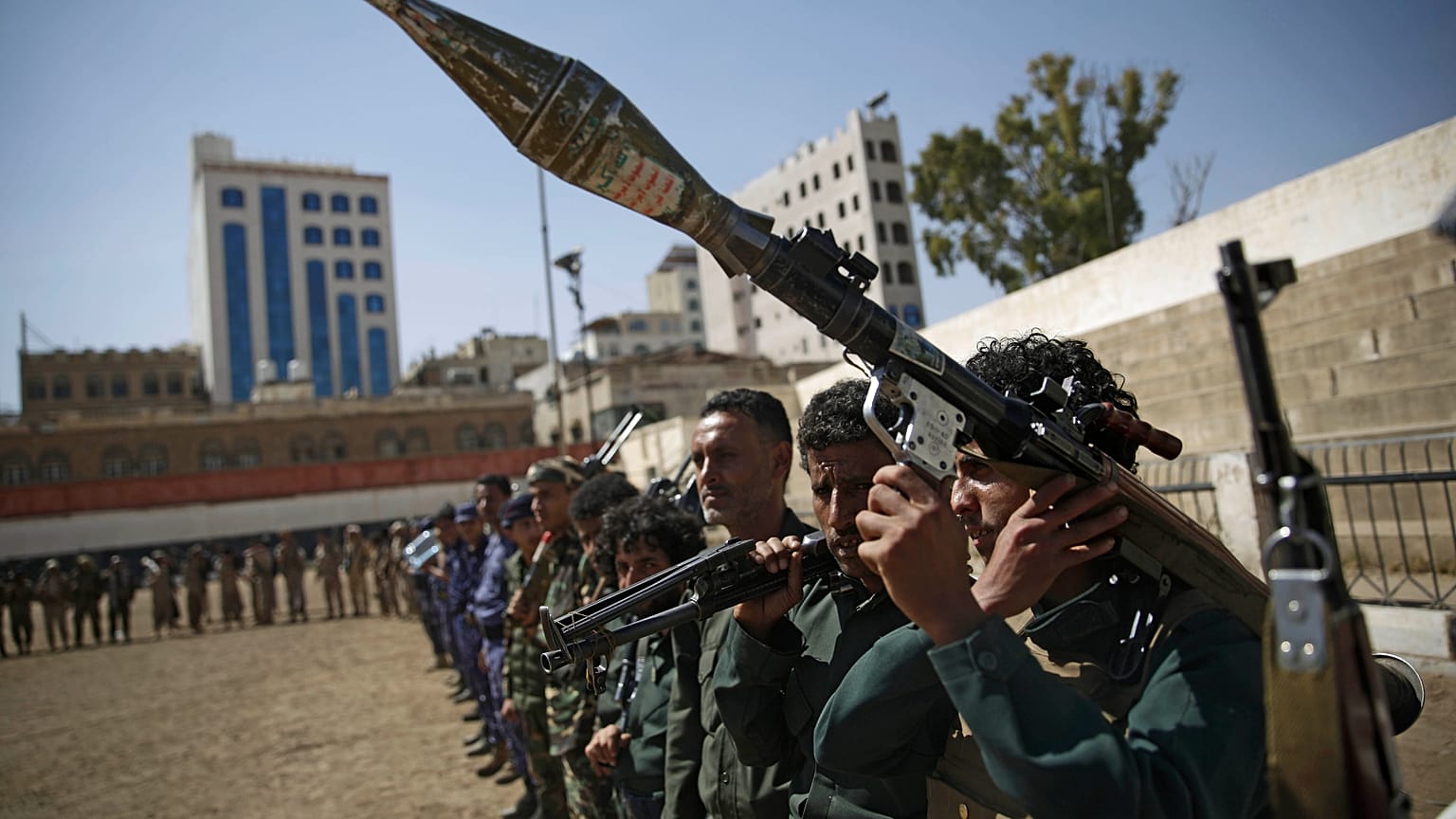 FILE: Houthi fighters display their weapons during a gathering in Sanaa, 20 February 2020