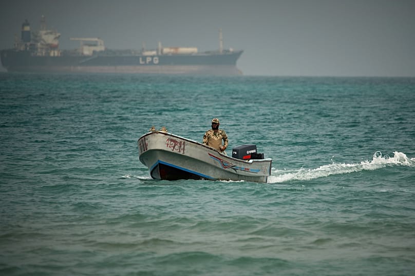 FILE: A Yemeni government soldier sails in waters north of the Bab el-Mandeb Strait in Mokha, 6 April 2026. 