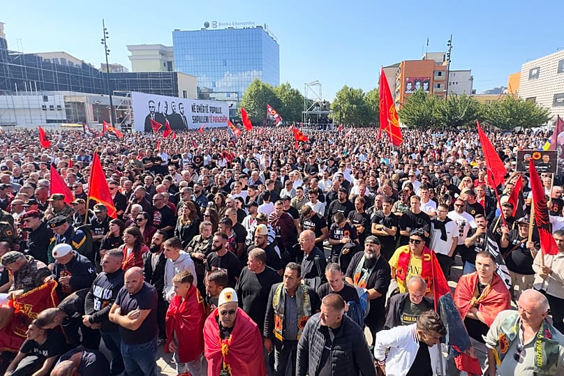 People gather in Prishtina to watch a broadcast of the verdicts for former Kosovo President Hashim Thaci and others at the court in The Hague, 16 September 2026