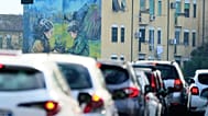 Cars in a traffic jam at a cross roads in Rome, Friday, Nov. 14, 2025