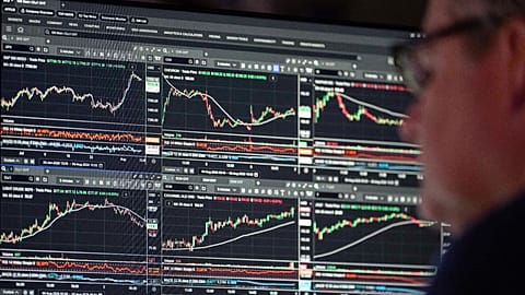 Financial market data is displayed on trading screens.