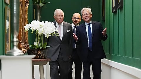 King Charles walks with Nvidia chief executive Jensen Huang and Sir Demis Hassabis. 17 September 2026