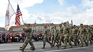  In this Wednesday, Aug. 15, 2018 file photo, a group of US Army soldiers take part in an annual military parade celebrating Polish Army Day in Warsaw, Poland.
