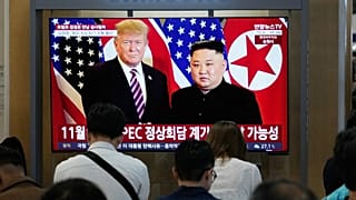 A TV screen shows a file image of North Korean leader Kim Jong Un and U.S. President Donald Trump during a news program at Seoul Railway Station in Seoul, South Korea.