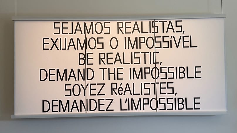 Cartel 'Be realistic, demand the impossible' en MUZEU, 16 de septiembre de 2026, Braga, Portugal.
