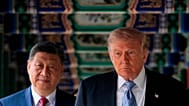 FILE. US President Donald Trump participates in a friendship walk through Zhongnanhai Garden with Chinese President Xi Jinping in Beijing, 15 May 2026