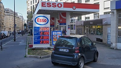 File - A car drives into a gas station as gasoline prices are displayed in Paris, Monday, 9 March 2026. 