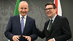 Britain's Prime Minister Andy Burnham, right, greets Ireland's Prime Minister Micheal Martin inside Heron House, the base of the government's Number 10 North, in Manchester.