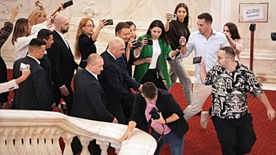 Romanian Prime Minister designate and European Parliament member Siegfried Muresan leaves surrounded by media after a press conference. 18 September 2026.