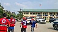 Red Cross members arrive at Banga National High School in the town of Banga, Philippines. 18 September 2026.