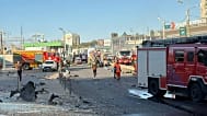 A first responder operates a fire hose after a Russian attack on an industrial zone near Korosten, Zhytomyr Oblast. 18 September 2026.
