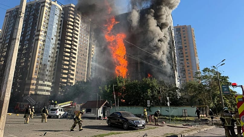 An office building on fire, in the aftermath of Russian strikes on central Odesa. 