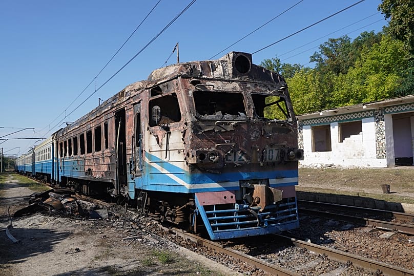 A burned commuter train sits after a Russian drone attack on a railway station in the Novovodolazka community, Kharkiv region, Ukraine, Friday, Sept. 18, 2026.