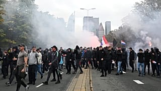 Protesters attend a far-right groups' protest against immigration and asylum policies