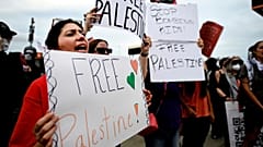 Pro-Palestinian demonstrators hold signs during a "Free Palestine" protest before an Ed Sheeran concert in Philadelphia, Saturday, Sept. 19, 2026