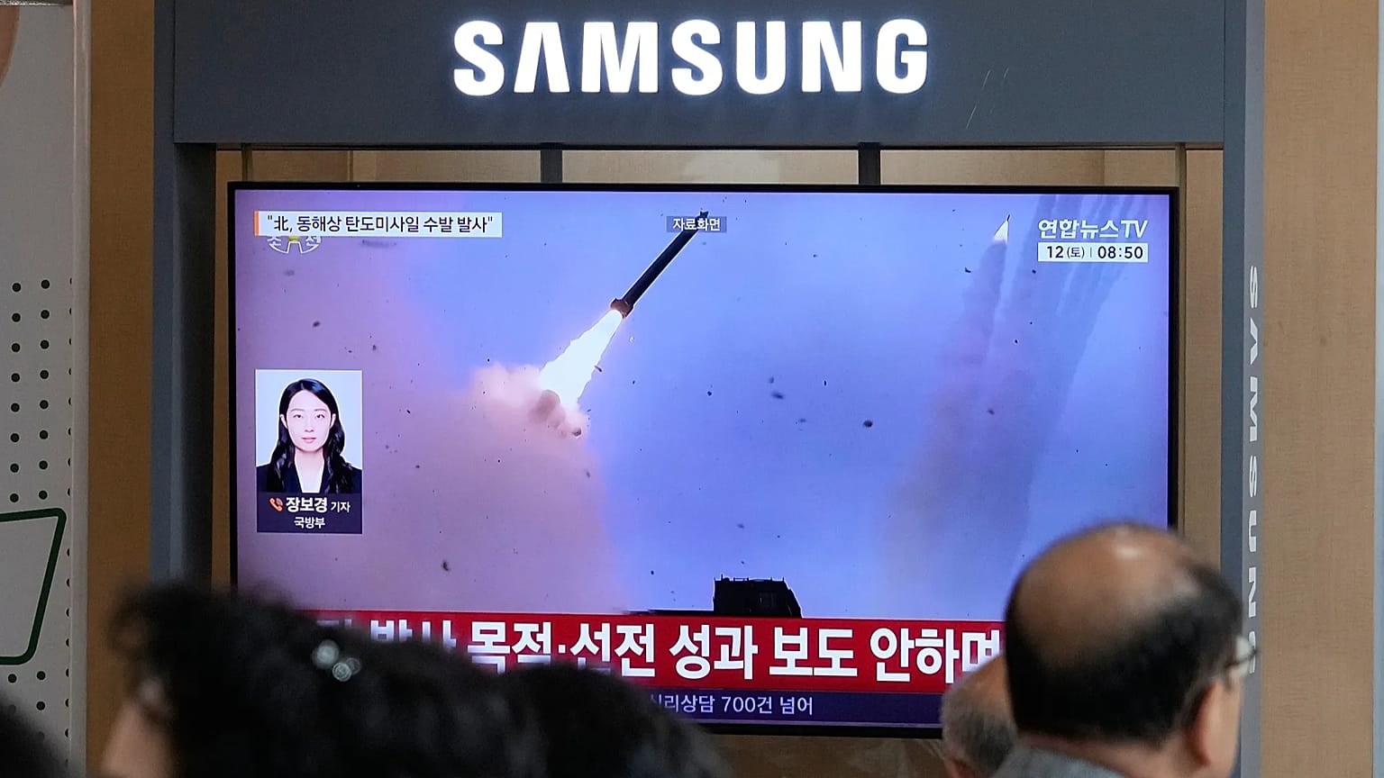 A TV screen shows a file image of a North Korean missile launch during a news program at Seoul Railway Station in Seoul, South Korea, Saturday, Sept. 12, 2026.
